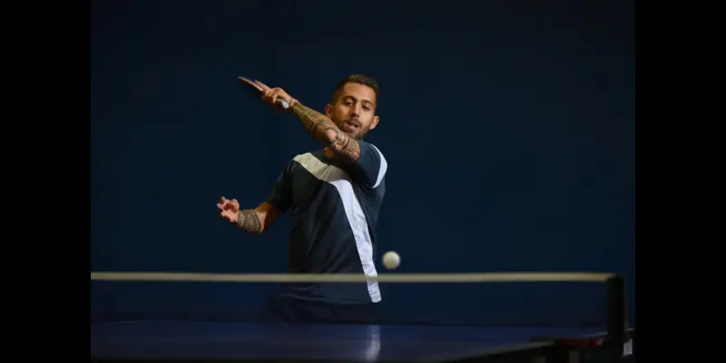 Dewatermark.ai 1738232817774 A player while playing a smash in table tennis